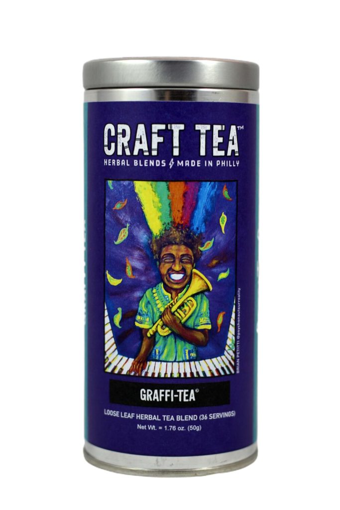 Craft Tea tin with colorful painting of Trumpet Wom